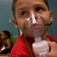 A Puerto Rican boy receives asthma treatment.